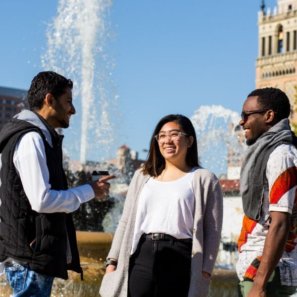 Group of med students stand near River Market entrance downtown KC
