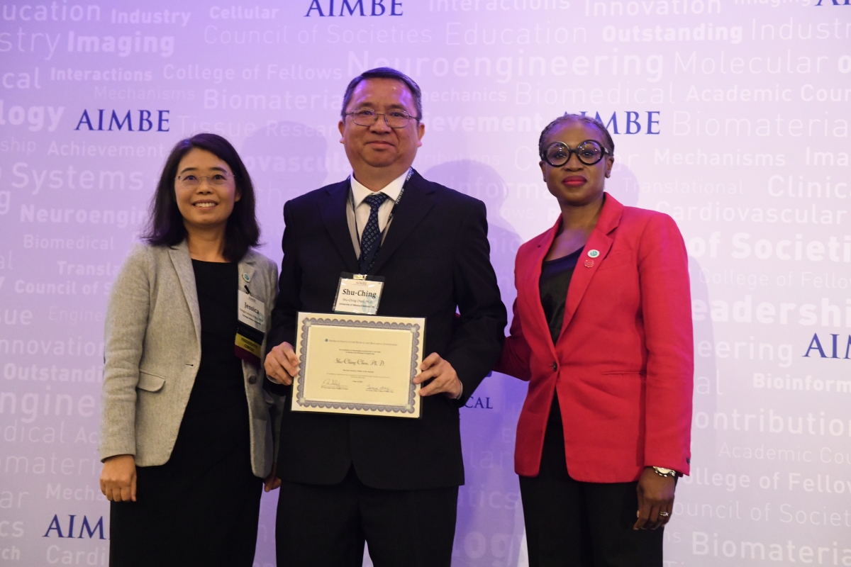 Shu-Ching Chen, Ph.D. poses with his certificate.