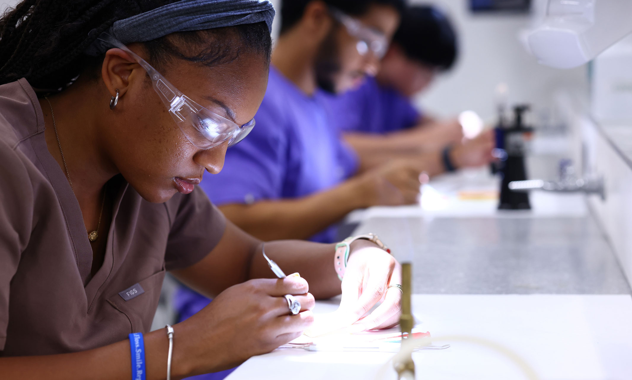 dental students practicing teeth cleaning
