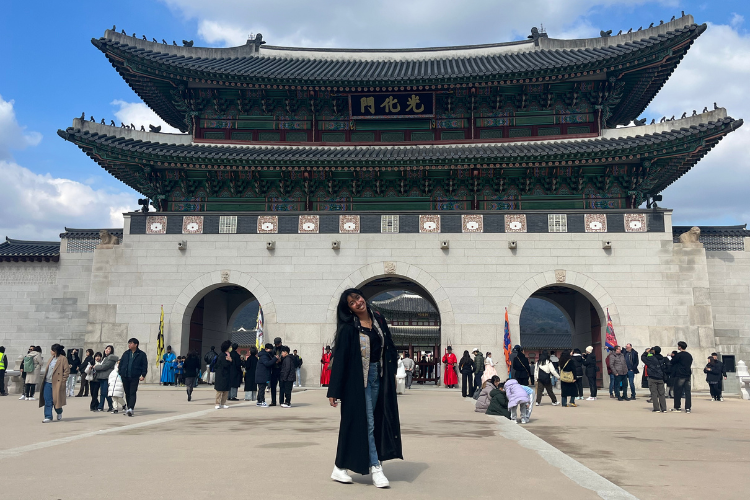 Liberty Gladden stands infront of a South Korea attraction.