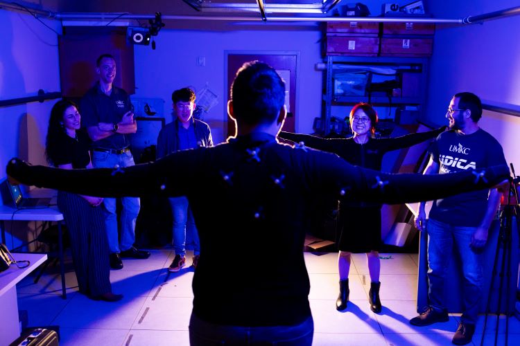 Nurse resesarcher Mei Fu and her team walk a participant through excercises.