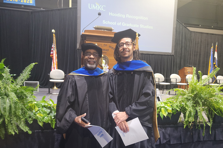 Matthew Robinson at his hooding ceremony