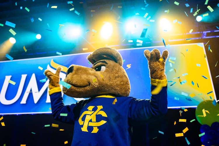 KC Roo stands with confetti falling